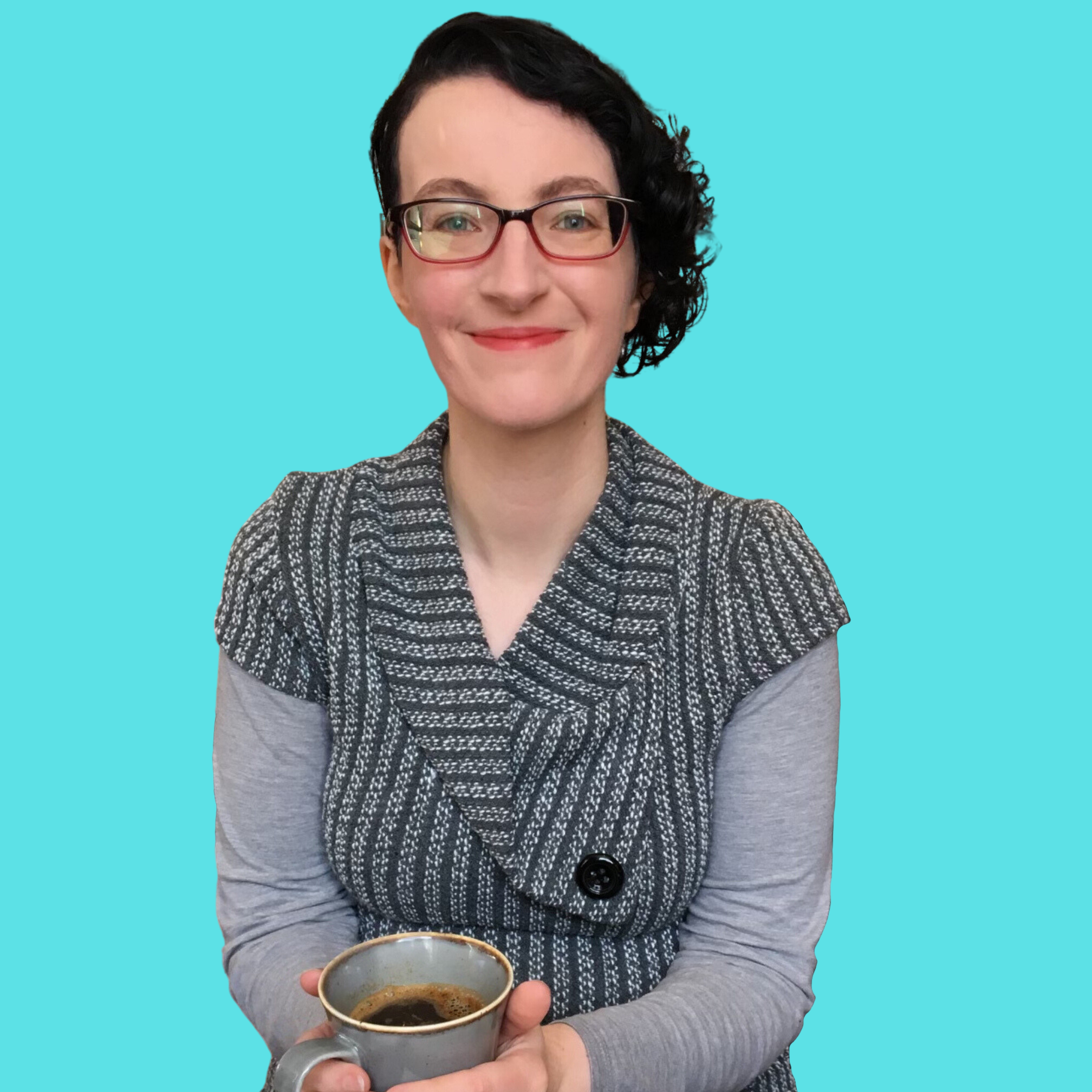 me smiling and holding a cup of coffee